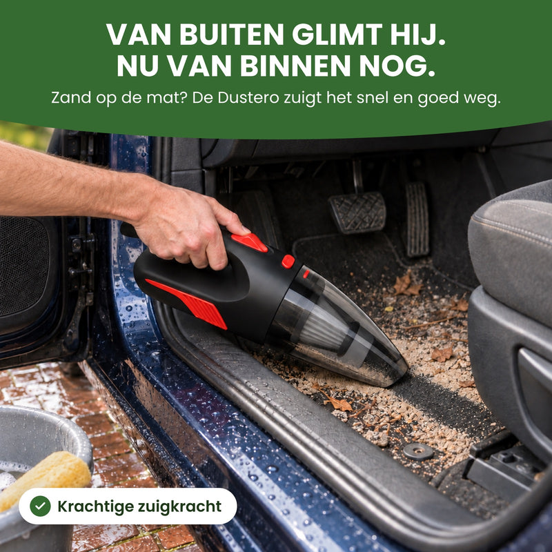 Hand zuigt met de zwarte Dustero zand van de automat van een pas gewassen auto op de oprit: van buiten glimt hij, nu van binnen nog