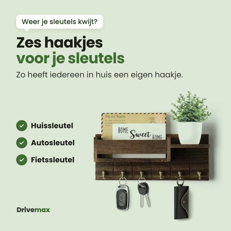 Het Entrova wandrek recht van voren met een autosleutel, een huissleutel en een sleutelhoesje aan de haakjes: zes haakjes voor je sleutels