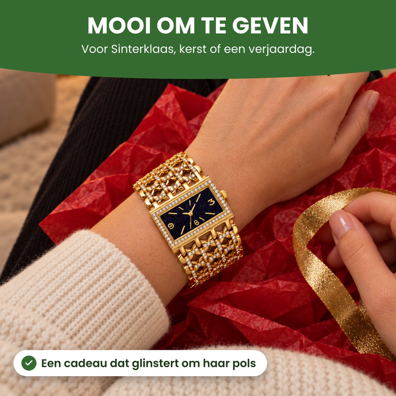 Pols met de Stellova op uitgepakt cadeaupapier, een hand met het lint: mooi om te geven, voor Sinterklaas, kerst of een verjaardag