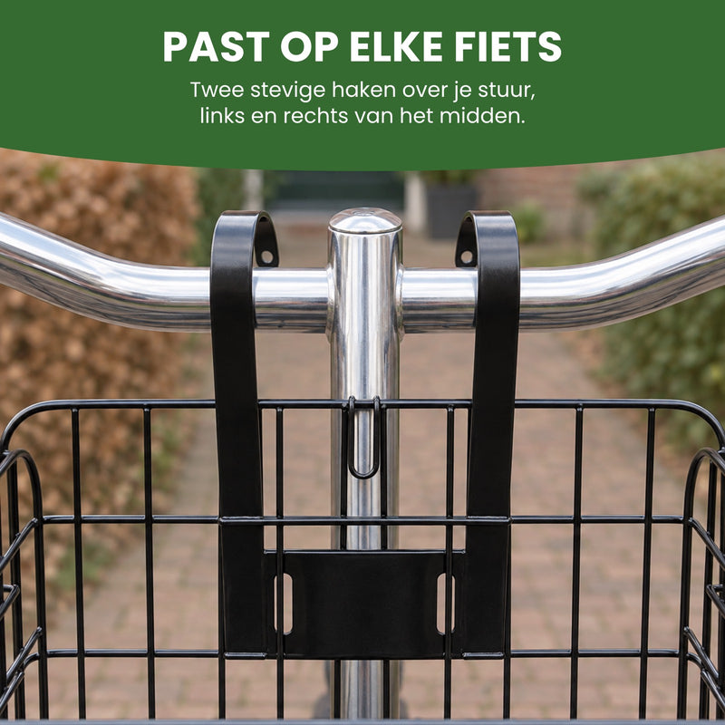 Twee platte zwarte haken van de Trego fietsmand over het stuur van een stadsfiets, links en rechts van de stuurpen: past op elke fiets